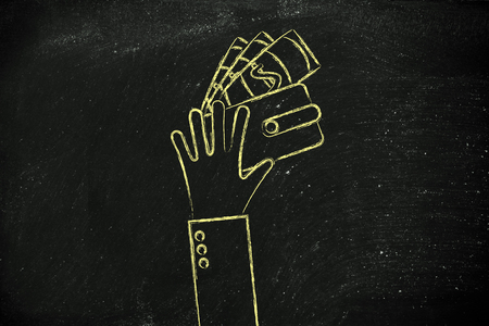 concept of saving & spending: hands holding a wallet with banknotesの写真素材