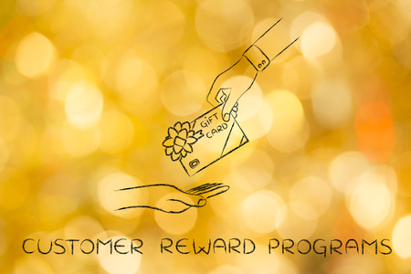 customer reward programs: hand giving gift card with bowの写真素材