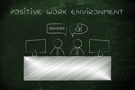 positive work environment: colleagues at office desk agreeing with each otherの写真素材