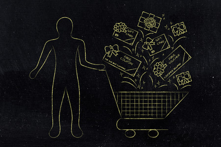 client standing next to shopping cart with plenty of gift cards and coupons to buy products for free, concept of customer rewards and fidelizationの写真素材