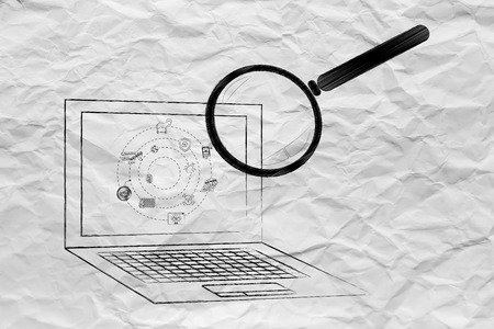 laptop being analyzed by magnifying glass for viruses or other threats, concept of antivirus system scanの写真素材