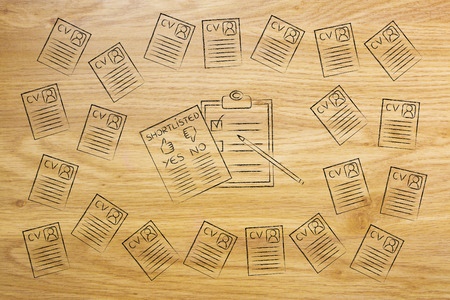 shortlist documents surrounded by lots of curriculum vitae resumes, concept of selecting the right candidates and catching the best talentsの写真素材