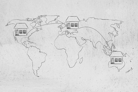 concet of moving to foreign countries and living as expat: house icon with arrows changing position on map of the world a few timesの写真素材