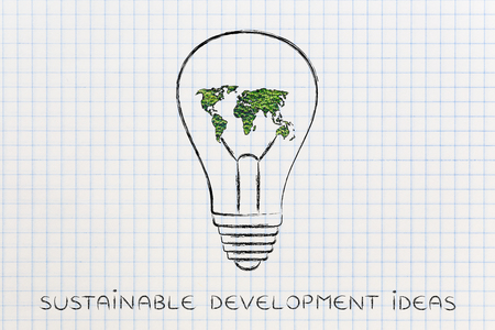 concept of solutions for the green economy: lightbulb with map of the world made of leavesの写真素材