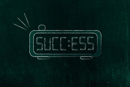digital alarm clock with the word Success on the screen instead of the timeの写真素材