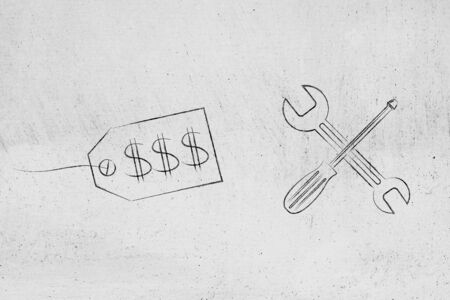 concept of fixing yourpricing strategy for the right market: price tag next to wrench and screwdriverの写真素材