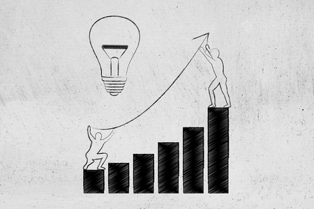 men setting up an arrow up a business growth graph next to lightbulb, concept of taking good entrepreneurial decisions and fixing a company situationの写真素材
