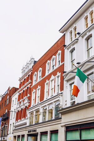 DUBLIN, IRELAND - 18th March, 2017: beautiful architecture in Dublin's city centre in Grafton Street featuring the Irish flagのeditorial素材