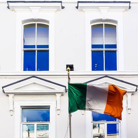 DUBLIN, IRELAND - 10th June, 2017: detail of the Irish flag waving from a department store's facade in Grafton Street in Dublin city centreのeditorial素材
