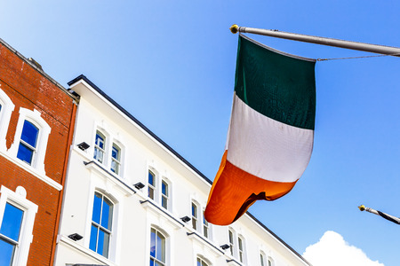 DUBLIN, IRELAND - 10th June, 2017: detail of the Irish flag waving from a department store's facade in Grafton Street in Dublin city centreのeditorial素材