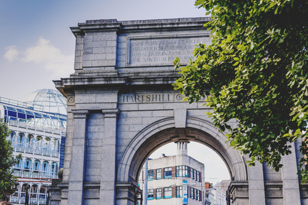 DUBLIN, IRELAND - 10th June, 2017: Arch at the entrance of St Stephen's park and the shopping centre in the background, in Dublin city centreのeditorial素材