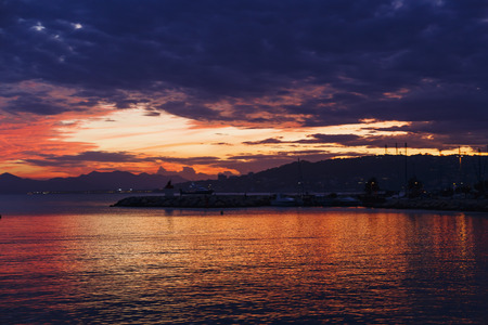 JUAN LES PINS, FRANCE - September 20th, 2016: Majestic sunset on the Mediterranean sea shot in Juan Les Pins on the French Rivieraのeditorial素材