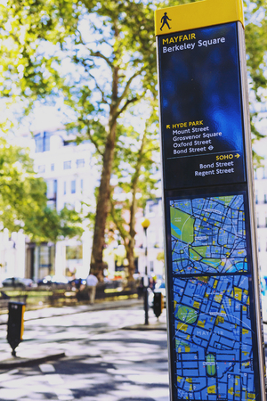 LONDON, UNITED KINGDOM - August 12th, 2016: Mayfair road sign with map and street bokeh in London city centreのeditorial素材