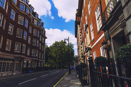 LONDON, UNITED KINGDOM - August 6th, 2016: Detail of beautiful buildings architecture in the streets of London city centre near Grosvenor Square and Duke Streetのeditorial素材