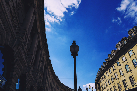 LONDON, UNITED KINGDOM - August 14th, 2016: Detail of beautiful buildings architecture in Regent Street in London city centre with vibrant summer skyのeditorial素材