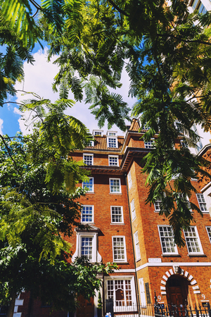 LONDON, UNITED KINGDOM - August 6th, 2016: Detail of beautiful buildings architecture in the streets of London city centre near Grosvenor Square and Duke Streetのeditorial素材