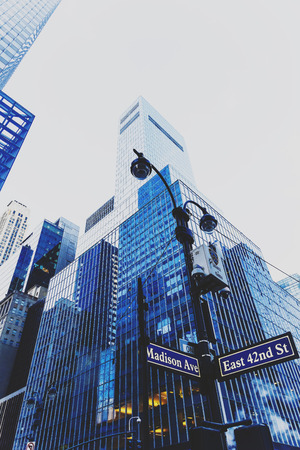 NEW YORK, NY - December 03, 2016: detail of Mahnattan's streets and skyscapers with Madison Aenue street signのeditorial素材