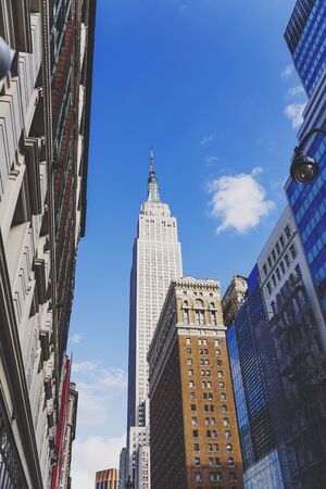 NEW YORK, NY - September 3rd, 2017: View of the Empire State Building from street level and surrounding buildingsのeditorial素材