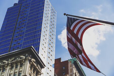 NEW YORK, NY - September 4th, 2017: American flag waving in the streets of Manhattanのeditorial素材