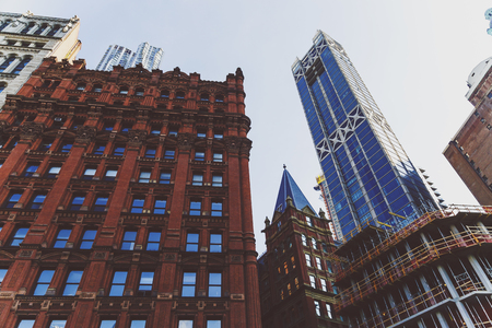 NEW YORK, NEW YORK - September 4th, 2017: Architecture and beautiful buildings along the streets of Manhattan New York in the City Hall area near Brooklyn Bridge on a sunny late summer dayのeditorial素材