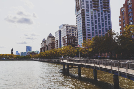 HOBOKEN, NJ - SEPTEMBER 10TH, 2017: Hoboken rivereside walk along the river Hudson with greenery and pedestriansのeditorial素材