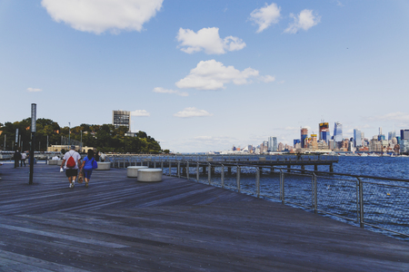 HOBOKEN, NJ - SEPTEMBER 10TH, 2017: View over Manhattan and the Hudson river from Hoboken rivereside walk (unidentified people)のeditorial素材