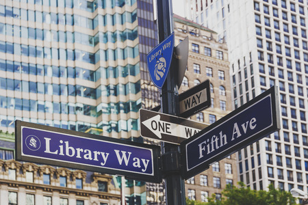 NEW YORK, NY - September 9th, 2017:  Library Way 5th Avenue road sign next to the NY Public Library and building bokehのeditorial素材