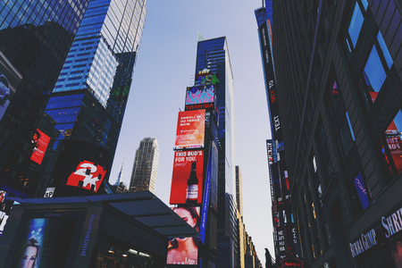 NEW YORK, USA - September 4th, 2017: buildings and billboards in Times Square, New York on a sunny...