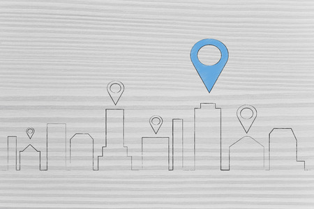 location services technology: city skyline with GPS icon over some buildingsの写真素材