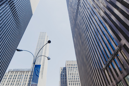 NEW YORK, NY - June 8th, 2014: detail of modern skyscrapers in Manhattan shot from a low perspective looking upのeditorial素材