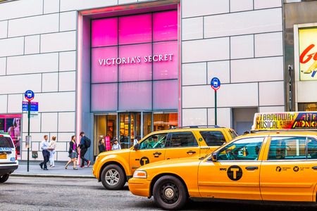 NEW YORK, NY - June 9th, 2014: yellow cabs in front of a Victoria's Secret shop in Manhattan