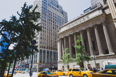 NEW YORK, NY - June 7th, 2014: busy Manhattan traffic in front of the Haier Building