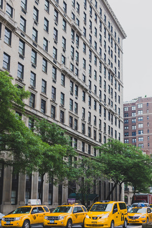 NEW YORK, NY - June 9th, 2014: line of yellow cabs in Madison Avenue, Manhattan