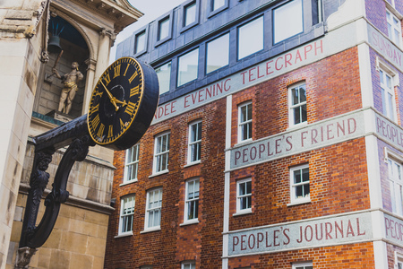 LONDON, UNITED KINGDOM - August 3rd, 2014: exterior of the the Dundee Courier building with text...