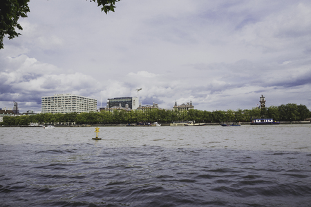 LONDON, UNITED KINGDOM - August 12th, 2014: view of the Thames next to the Palace of Westminsterのeditorial素材