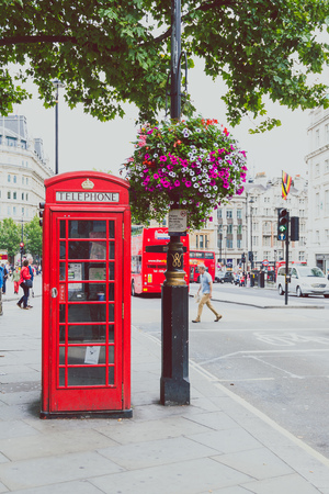 LONDON, UNITED KINGDOM - August, 16th, 2015: red phone box near Trafalgar Square in London city centreのeditorial素材