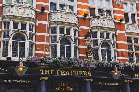 LONDON, UNITED KINGDOM - August, 16th, 2015: pub exterior with flower compositions in London city centreのeditorial素材