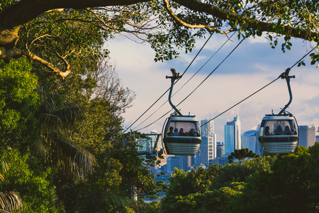 SYDNEY, AUSTRALIA - July 11th, 2013: Taronga zoo cable car with view over Sydney's skyline in the distanceのeditorial素材