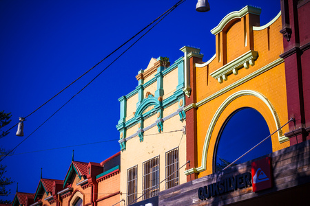 SYDNEY, AUSTRALIA - July 7th, 2013: colorful buildings in Manly Beach's main street the Corsoのeditorial素材