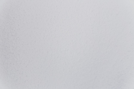 white snow background with visible texture close-up shot の写真素材