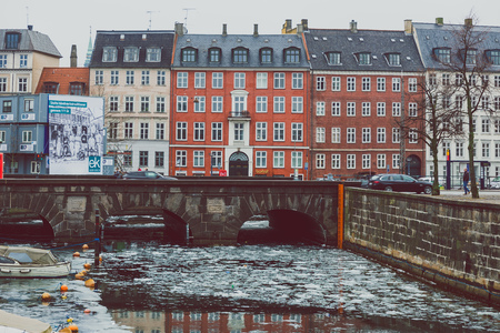 COPENHAGEN, DENMARK - March 11th, 2018: Architecture and buildings of the streets of Copenhagen featuring frozen canals with ice blocks in the waterのeditorial素材