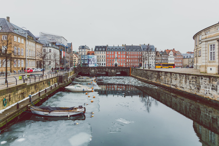 COPENHAGEN, DENMARK - March 11th, 2018: Architecture and buildings of the streets of Copenhagen featuring frozen canals with ice blocks in the waterのeditorial素材