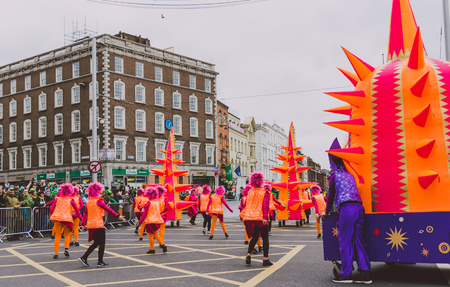 DUBLIN, IRELAND - 17th March, 2018: performers and crowd participating in the 2018 Saint Patrick's parade in Dublin on O'Connell Bridge in the city centreのeditorial素材