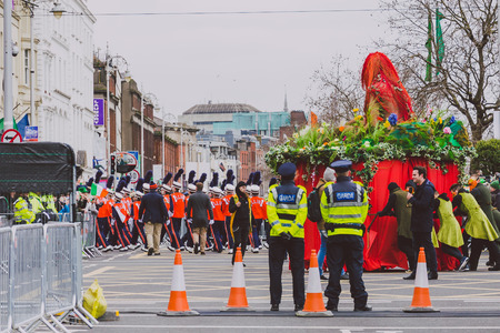 DUBLIN, IRELAND - 17th March, 2018: performers and police officers at the 2018 Saint Patrick's...