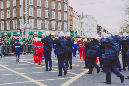 DUBLIN, IRELAND - 17th March, 2018: performers and crowd participating in the 2018 Saint Patrick's parade in Dublin on O'Connell Bridge in the city centreのeditorial素材