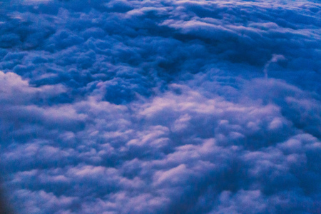 thick layers of clods shot from airplane window seat on a commercial flight over Norther Europeの写真素材
