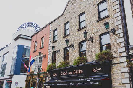 DUBLIN, IRELAND - April 12th, 2018: pubs in the Temple Bar neighbourhood of Dublin city centre, the area is famous for its popular traditional pubs and nightlifeのeditorial素材