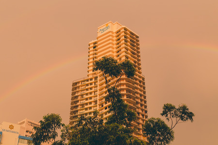 GOLD COAST, AUSTRALIA - January 6th, 2014: rainbow and stormy skies over the skyscrapers in Sufers Paradise, Gold Coastのeditorial素材