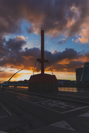 DUBLIN, IRELAND - May 9th, 2018: Majestic orange and pink toned sunset over the river Liffey in...
