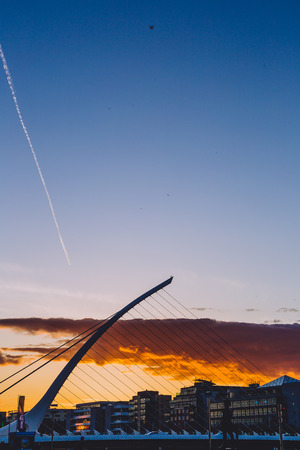 DUBLIN, IRELAND - May 13th, 2018: Sunset along the river Liffey featuring the Samuel Beckett bridge...